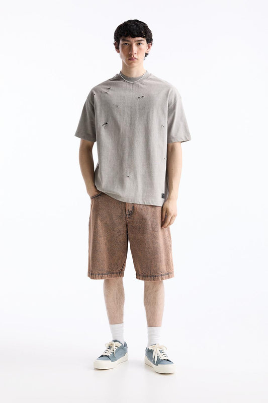 Baggy denim Bermuda shorts with a washed finish